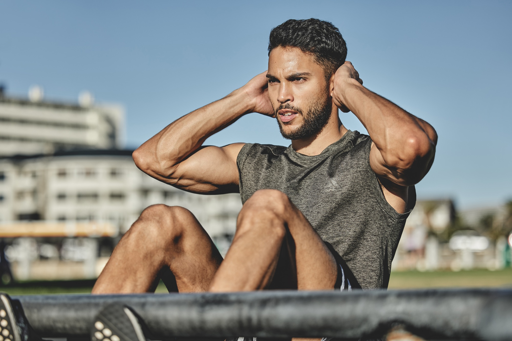 All youve got to do is not quit. Shot of a muscular young man exercising at a calisthenics park.