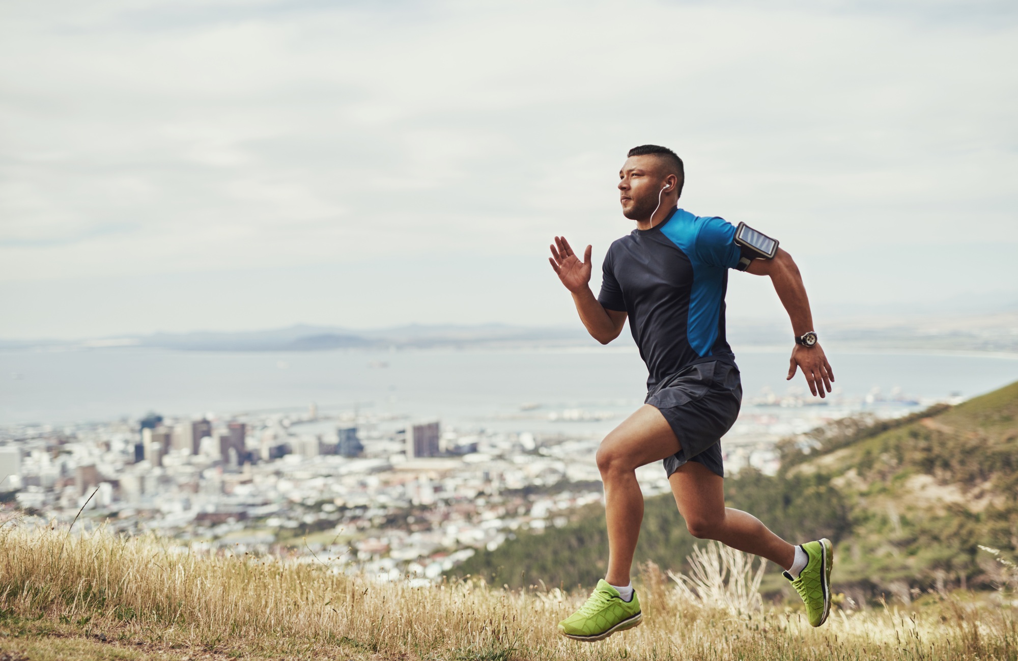 Taking the steps toward a healthier life. Full length shot of a young man running outdoors.