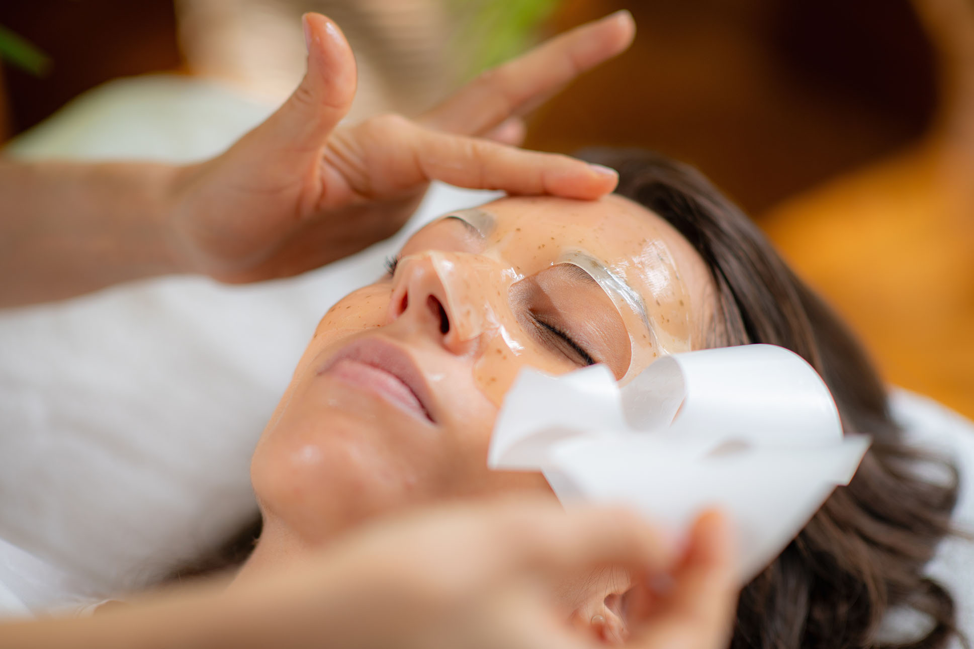Client relaxing during a hydrating medical facial at Hideaway Wellness & Aesthetics